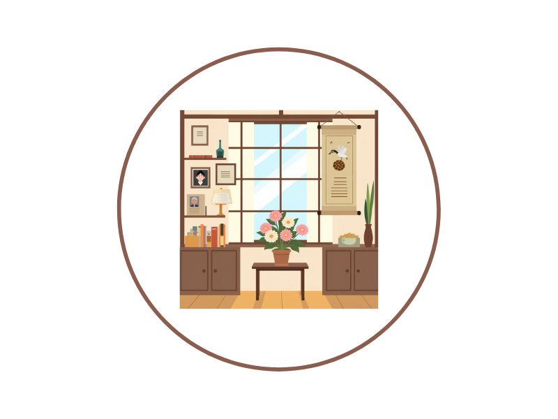 15 | Ordonna Guide Cozy home office scene with a central table holding a vase of flowers, flanked by cabinets and shelves, and a large window in the background.