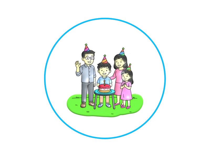 Family of four wearing party hats around a birthday cake on a small grass patch outside.