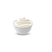 White ceramic bowl filled with whipped cream, swirled into soft peaks at the center.