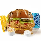 Combo meal with crispy chicken sandwich, french fries, coleslaw, two dipping sauces, and a blue soda.