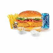 Combo meal with a sesame-bun burger, fries, two dipping sauces, and a blue soda can on a white background.