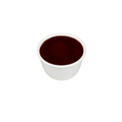 Small white ceramic cup filled with dark coffee seen from above on a white background.